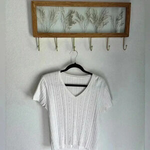 Light weight coastal knit top in white with pear and crystal details fits s/m!